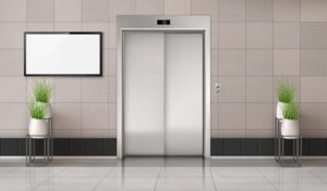Office,Hallway,With,Closed,Elevator,Door,And,Tv,Screen,On